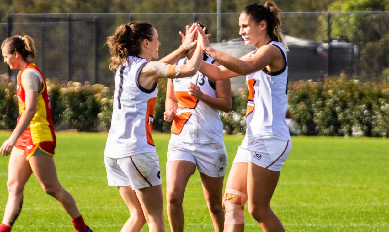 SLIDER-WINTERSERIESRND2.jpg Alicia Eva (left) and Louise Stephenson (right) celebrate a goal for the Northern GIANTS in their win over the Suns on Saturday. - GWS Giants,AFLW,Gold Coast Suns,Brisbane Lions